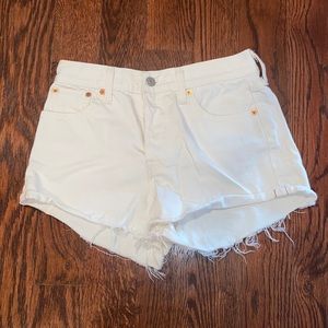 Levi’s ripped white jean shorts